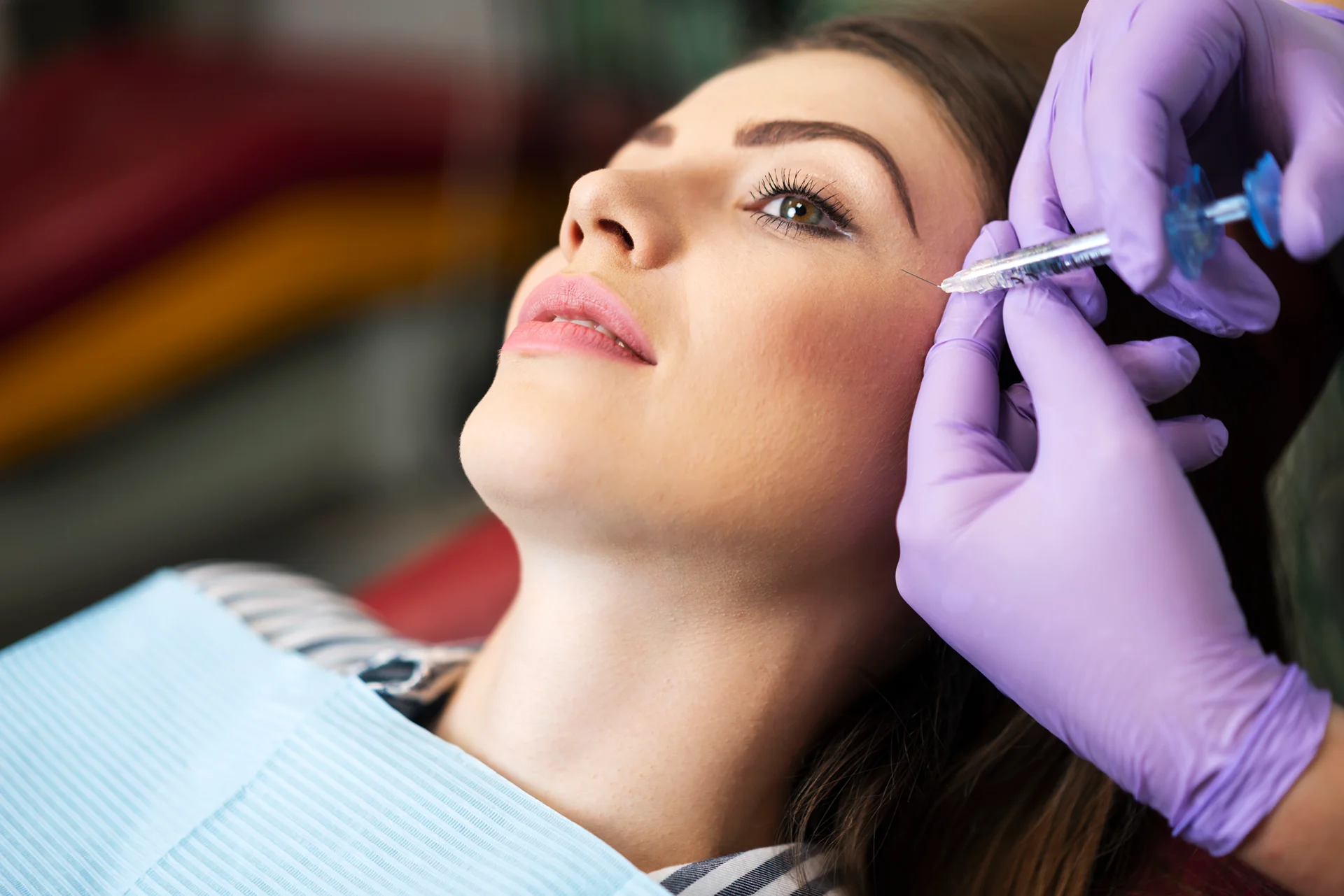 A woman getting cheek fillers||