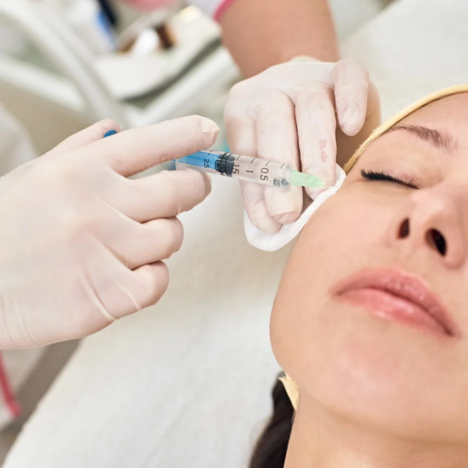 a woman getting cheek fillers