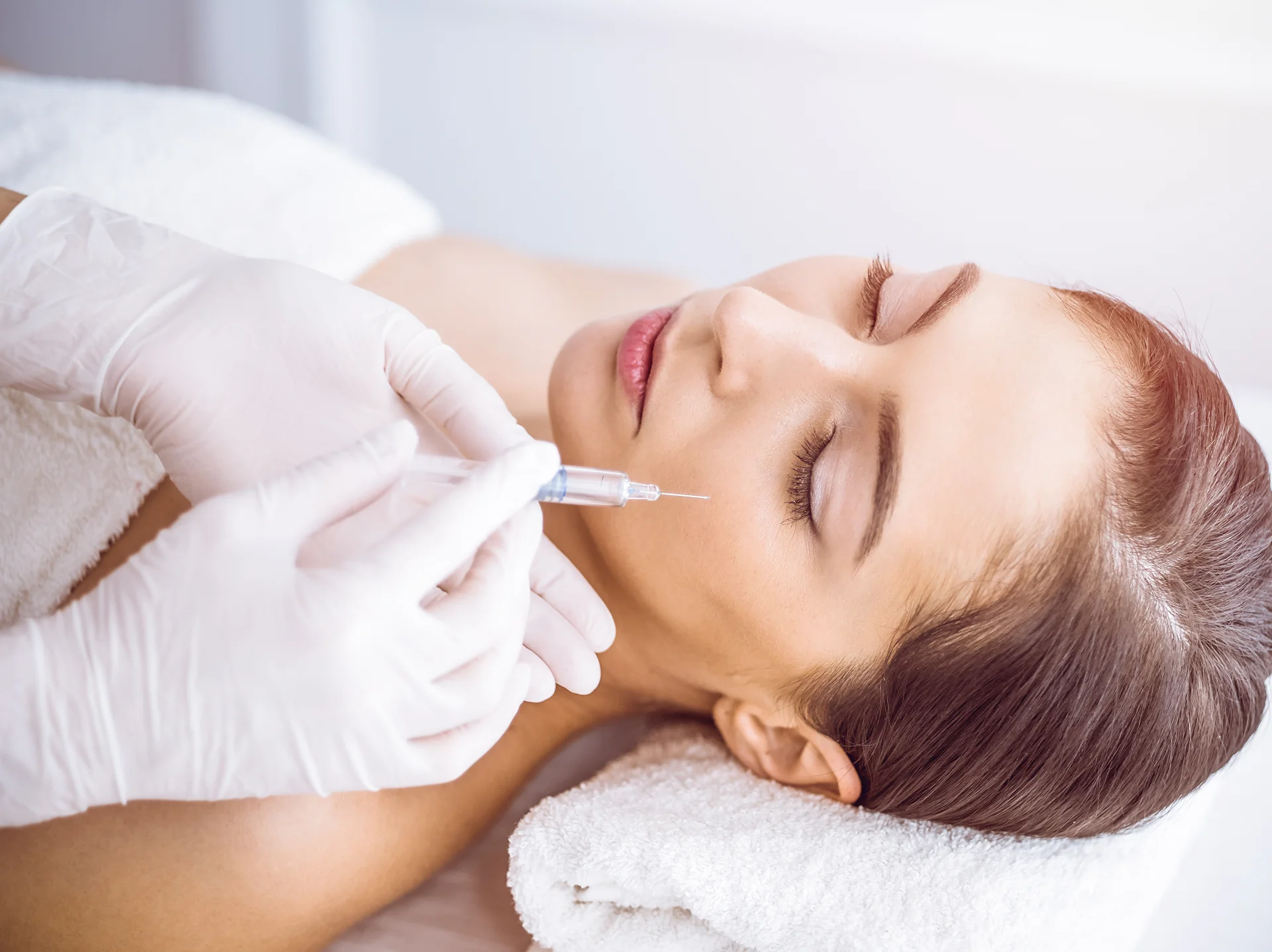 a woman getting cheek fillers||