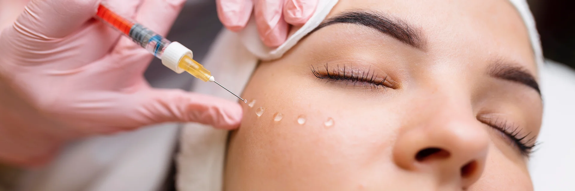 a woman getting cheek filler||