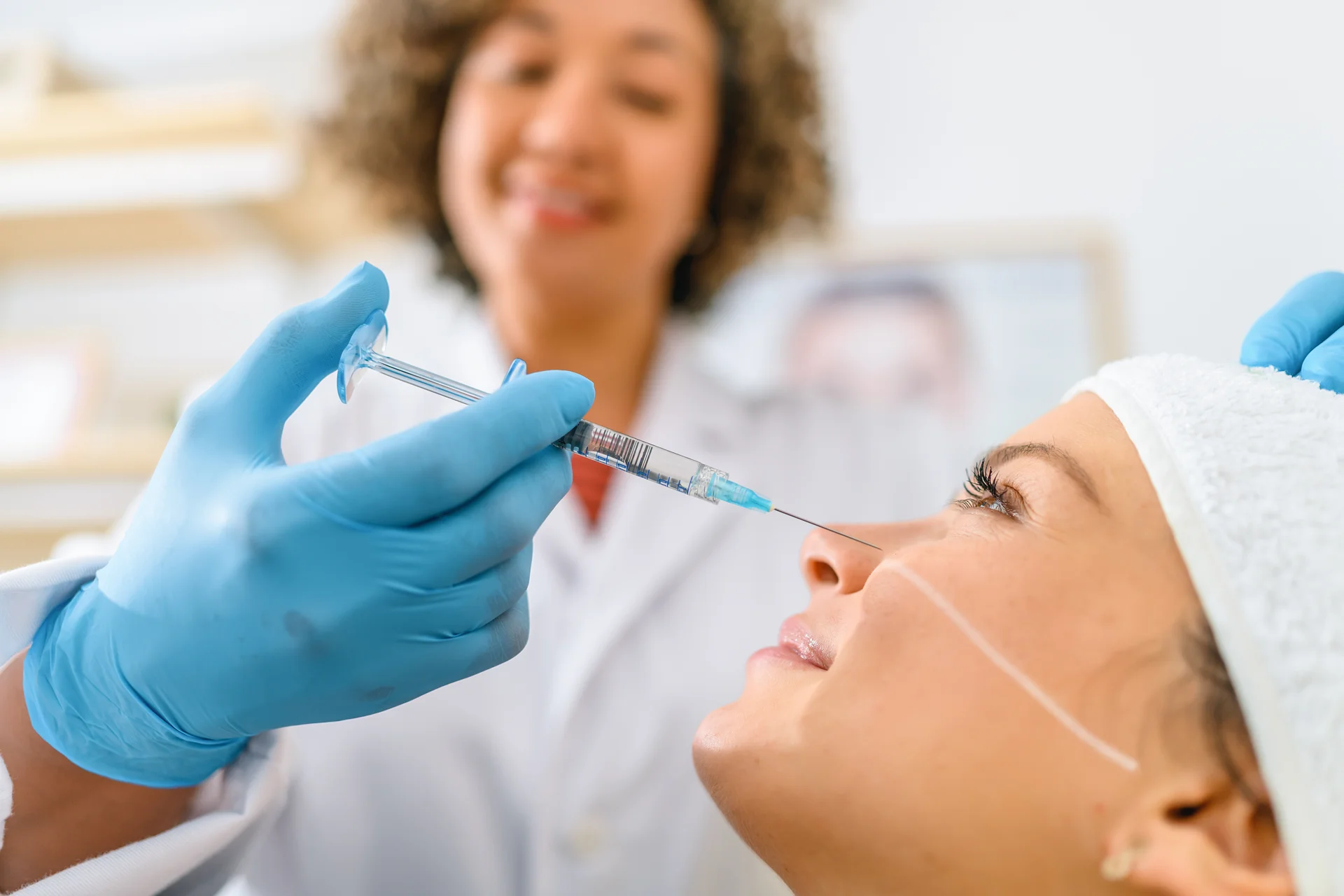 a woman getting cheek filler||